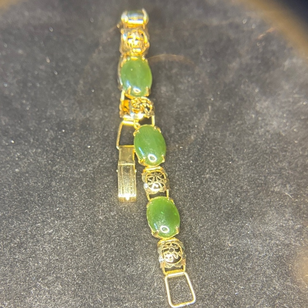 Luxurious Gold Bracelet with Green Accents